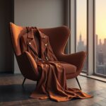 "A stylish brown suede jacket displayed on a hanger against a neutral background, showcasing its soft texture and luxurious appeal."